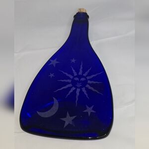 Cobalt blue glass Spoonrest bottle with a celestial sun and moon Shilo Glass